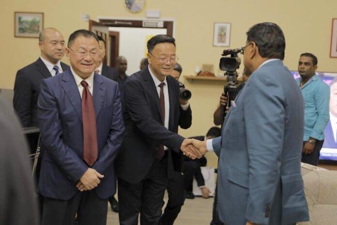 Delegatie Dalian International Group bezoekt president